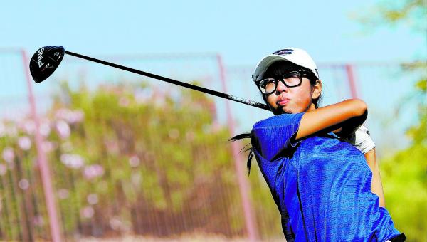 Green Valley junior Mercedes Khumnark watches her tee shot on the 10th hole during the final ...