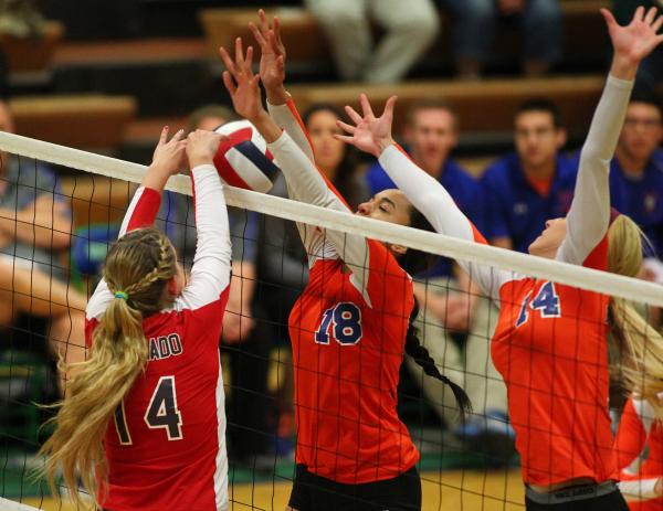 Coronado’s Cali Thompson (14) tips the ball over the net against Bishop Gorman during ...