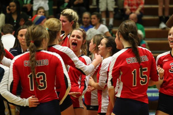 Coronado players celebrate after the Cougars rallied from two sets down to defeat Palo Verde ...