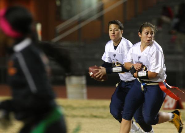 Foothill quarterback Sam Fennell (13) rolls to her right in a game with Chaparral on Wednesd ...