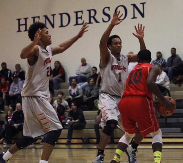 Findlay Prep’s Rashad Vaughn (1) and Kelly Oubre Jr. (22) attempt to trap Planet Athle ...