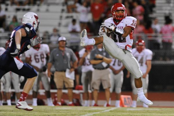 Arbor View running back Devon Turner (12) catches a pass in front of Coronado defender Koy H ...