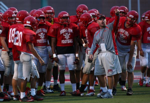 Arbor View football coach Dan Barnson talks to his team during Tuesday’s practice. The ...