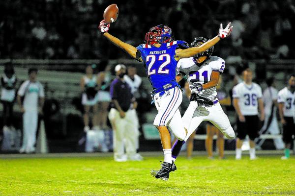 Liberty’s Deseon McQuaig (22) seen jumping to catch a pass over Silverado’s Dani ...