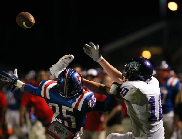 Liberty’s Ethan Dedeaux (25) jumps to break up a pass to intended for Silverado’ ...