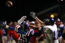 Liberty’s Ethan Dedeaux (25) jumps to break up a pass to intended for Silverado’ ...
