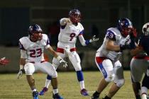 Liberty’s Tyler Newman (9) throws a pass on Friday night. Newman threw for 283 yards a ...