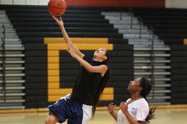 Clark sophomore Jenny Vasquez drives to the basket during a recent practice.
