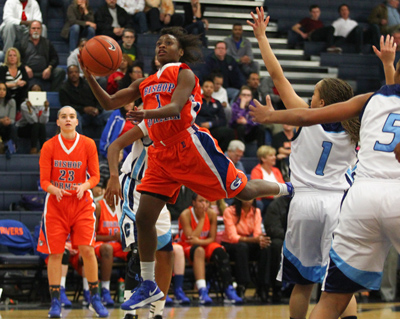Bishop Gorman’s Tonishia Childress attempts a shot against Centennial during a game at ...