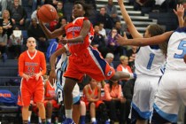 Bishop Gorman’s Tonishia Childress attempts a shot against Centennial during a game at ...