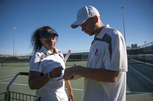 Hannah Tatlock, left, talks strategy with her father and Mojave head coach David Tatlock bef ...