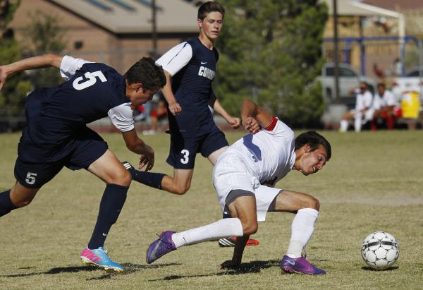 Liberty forward Danny Musovski battles past a pair of Coronado defenders on Wednesday. Musov ...