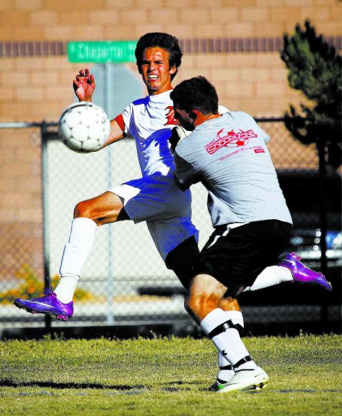 Liberty forward Danny Musovski, left, bears down on Coronado goalkeeper Cody Capps in the Pa ...