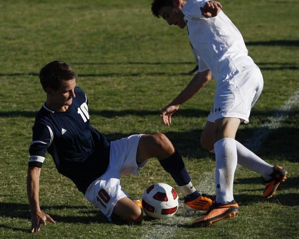 Legacy midfielder Luka Skrinjaric, left, goes for a slide tackle agains Palo Verde’s & ...