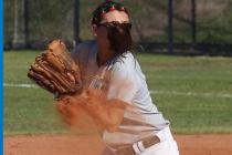 Green Valley softball player Cori Sutton is blinded by her ponytail on a throw to home in a ...