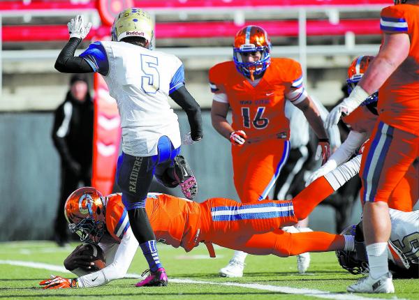Bishop Gorman quarterback Randall Cunningham (12) dives into the end zone for a touchdown on ...