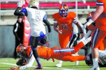 Bishop Gorman quarterback Randall Cunningham (12) dives into the end zone for a touchdown on ...