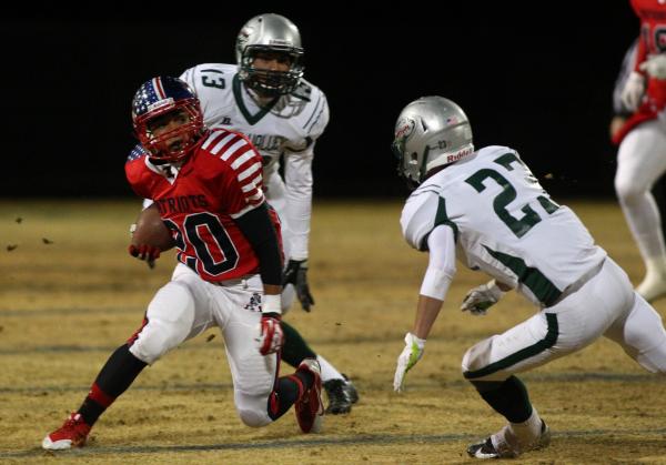 Liberty’s Darrien Acohido (20) looks for running room against Green Valley&# ...