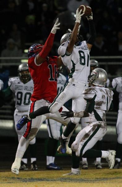 Green Valley’s Kyle Parker (81) leaps to intercept a pass intended for Liberty’s ...