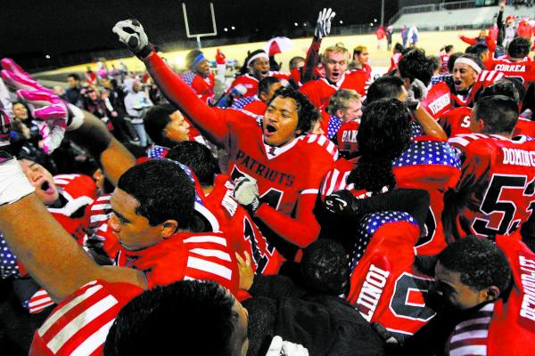 Liberty players celebrate after their win over Green Valley in the Sunrise Region final.