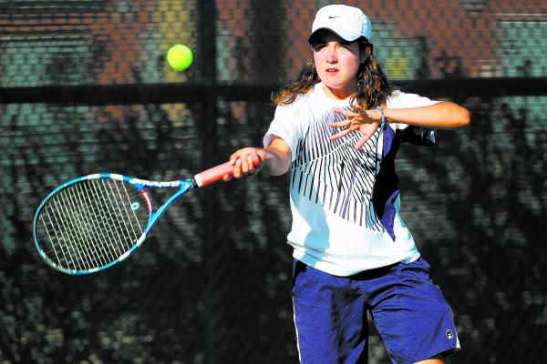 Coronado’s Lauren Coons returns the ball against Green Valley’s Megan Madrid on ...