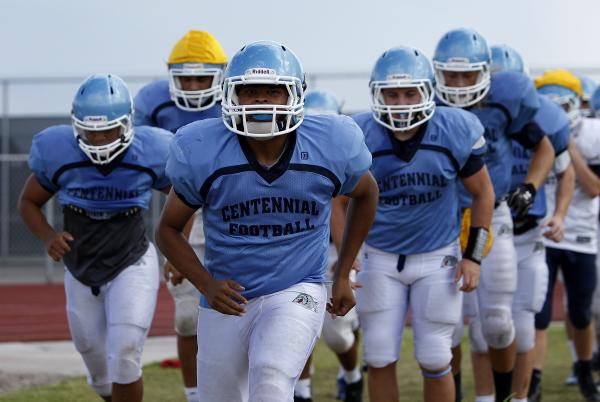 Centennial linebacker Toby Lopez, front, takes part in drills at Wednesday’s practice. ...
