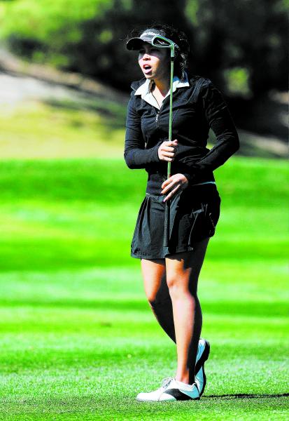 Cimarron-Memorial’s Aspen Bryant reacts after her second shot on the second hole durin ...