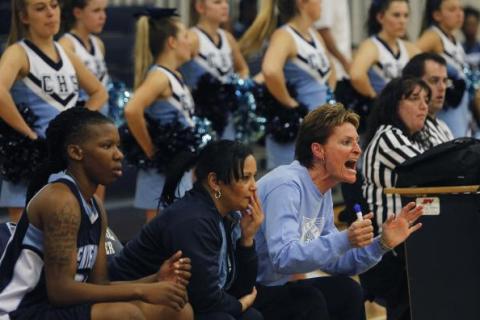 Centennial girls basketball coach Karen Weitz yells out instructions to her team in a game a ...
