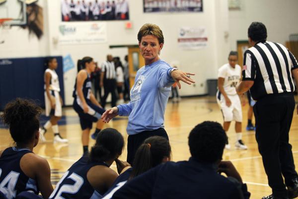 Centennial girls basketball coach Karen Weitz walks the sidelines during her team’s ga ...