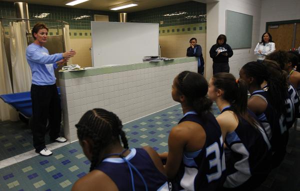Centennial coach Karen Weitz instructs her team during halftime of their game against Shadow ...