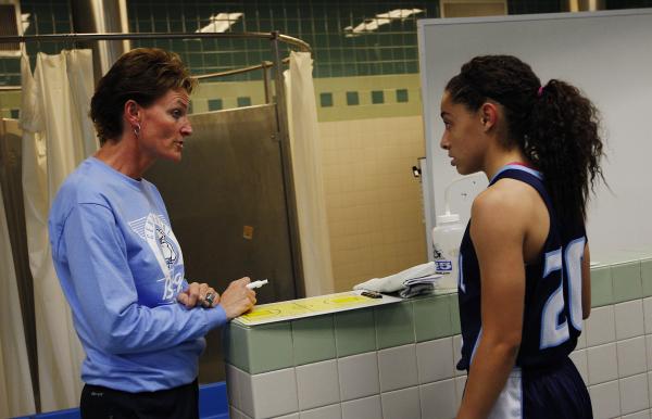 Centennial girls basketball coach Karen Weitz, left, talks with senior guard Simone Barber d ...