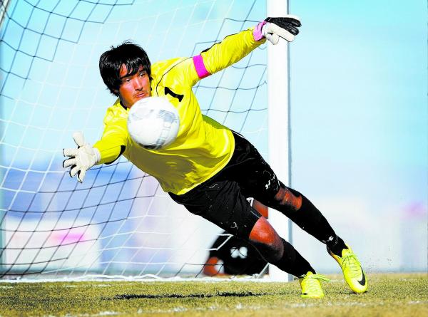 Palo Verde High School goalkeeper Nishesh Yadav dives to make a save while warming up before ...