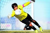 Palo Verde High School goalkeeper Nishesh Yadav dives to make a save while warming up before ...