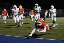 Bishop Gorman’s Daniel Stewart dives into the end zone to score against Crespi (Calif. ...
