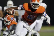 Bishop Gorman quarterback Randall Cunningham, seen carrying the ball against Crespi (Calif.) ...