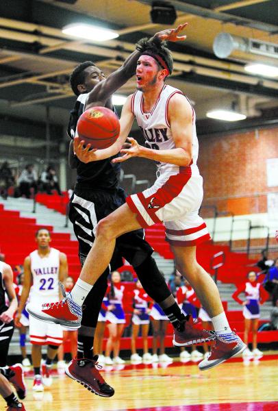 Valley’s Spencer Mathisgoes up for a shot against Coronado’s KeDean Toney on Wed ...