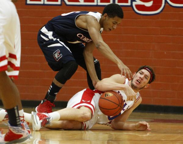 Valley’s Spencer Mathis, on ground, and Coronado’s Eddie Austin battle for the b ...