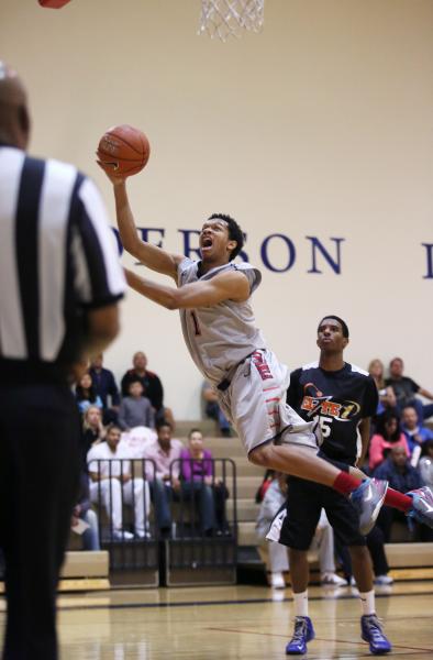 Findlay Prep’s Rashad Vaughn (1) takes a shot as PHASE 1 Academy’s Reece Brooks ...