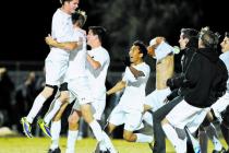 Palo Verde’s Austin Manthey (11) celebrates with his team after scoring the clinching ...