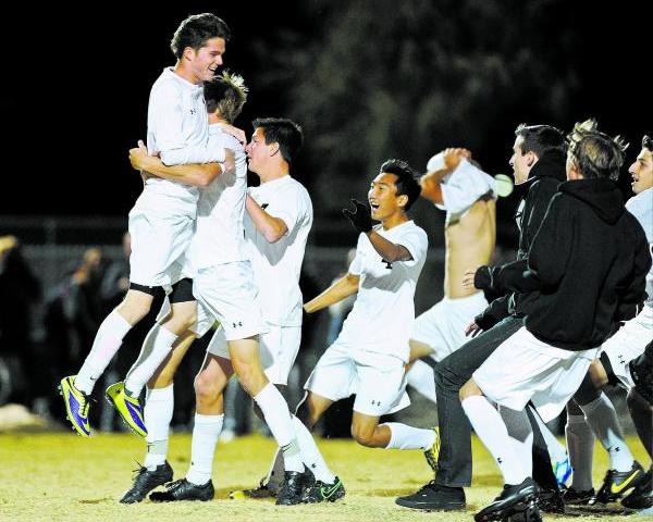 Palo Verde’s Austin Manthey (11) celebrates with his team after scoring the clinching ...