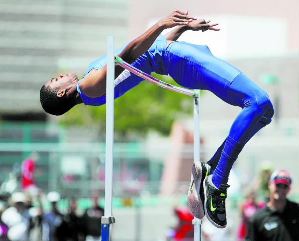 Bishop Gorman’s Randall Cunningham clears the bar during high jump competition on Satu ...
