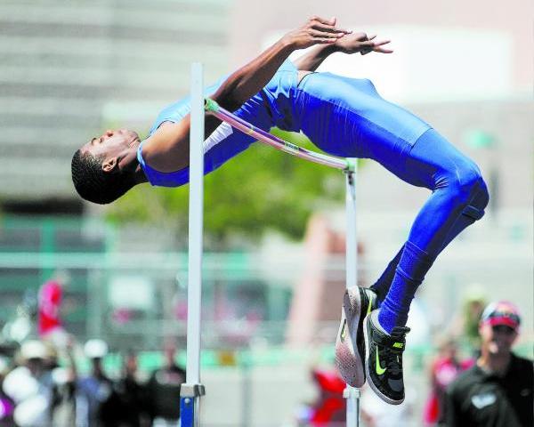 Bishop Gorman’s Randall Cunningham clears the bar during high jump competition on Satu ...