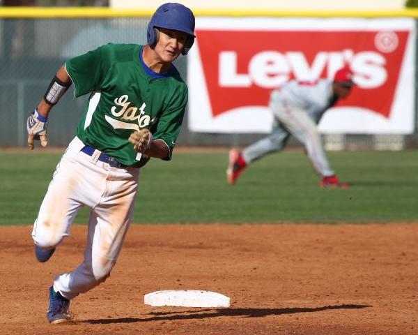 Keola Paragas runs to third base on Jarod Penniman’s fifth-inning single, Green Valley ...