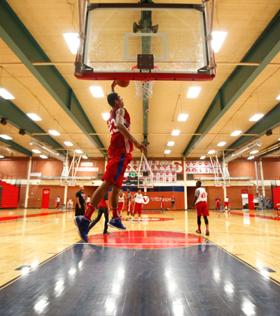 Valley High School basketball senior forward Daniel Young makes a dunk during practice at th ...