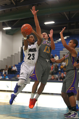 Canyon Springs’ Shaquile Carr looks to shoot over Durango’s Paris Estrada during ...