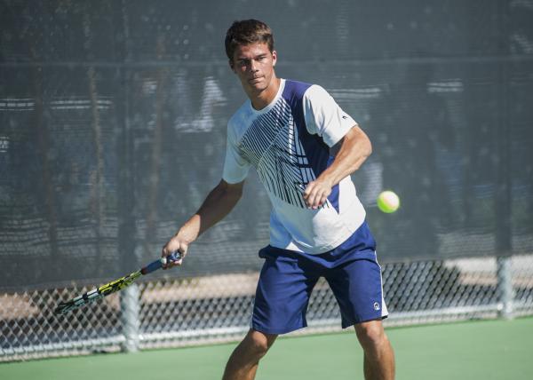 Coronado’s Cassell King keeps his eye on the ball in the boys singles final.