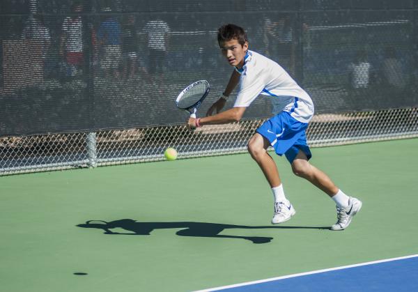 Bishop Gorman’s Dylan Levitt, reaches for a backhand in the boys singles final.