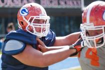Bishop Gorman senior Zack Singer, left, shown Wednesday at practice, embraces his move to ce ...