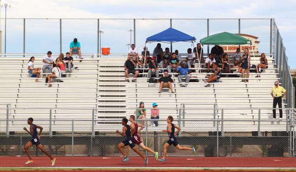 Centennial junior Tiana Bonds clears a hurdle on her way to victory in the 100-meter hurdles ...