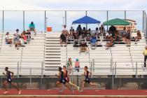 Centennial junior Tiana Bonds clears a hurdle on her way to victory in the 100-meter hurdles ...